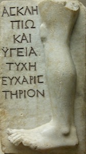 Photo showing writing from Ancient Greece and image of leg