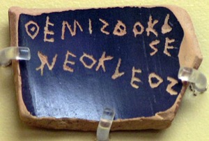 Photo showing pottery fragment with Ancient Greek writing